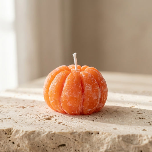 Miniature peeled tangerine candle styled beautifully as a cheerful, lifelike citrus accent on a vibrant kitchen table.