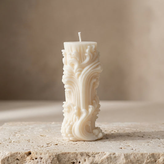 Ornate baroque pillar candle styled beautifully as a sophisticated, vintage-inspired antique accent on an elegant mantelpiece.