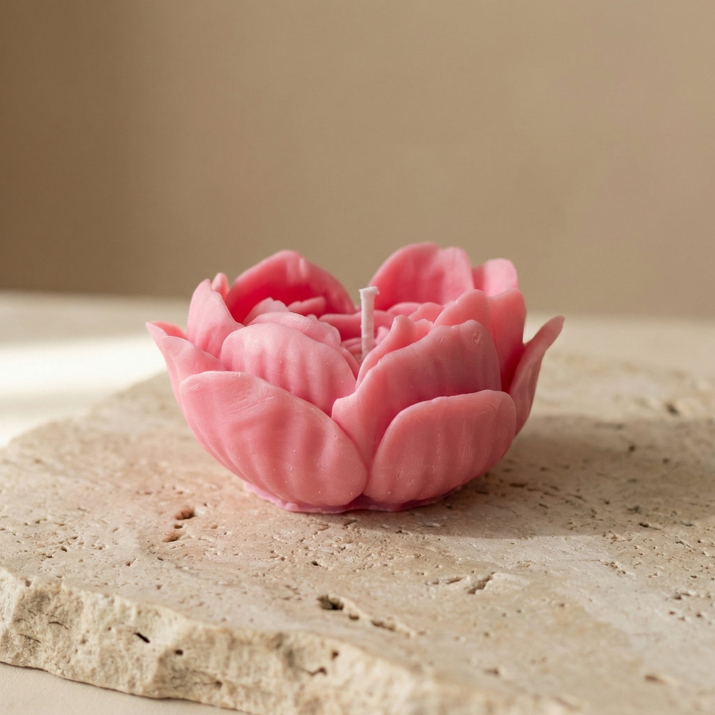 Close-up of a hand-poured soy wax floral rose heart candle highlighting its perfect heart shape formed by delicate, overlapping flower petals.