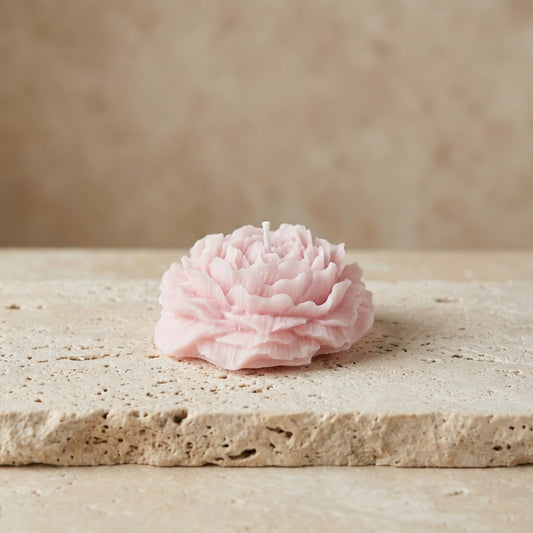 Sculptural peony blossom candle styled elegantly as a sophisticated, romantic botanical accent on a modern bedroom vanity.
