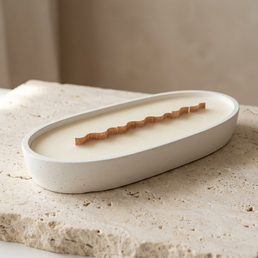 Artisan oval centerpiece candle burning with a mesmerizing wide horizontal flame, styled beautifully as a luxury focal point on a modern dining table.