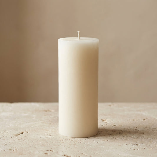 Close-up of a hand-poured soy wax classic smooth pillar candle highlighting its clean, minimalist cylindrical shape.