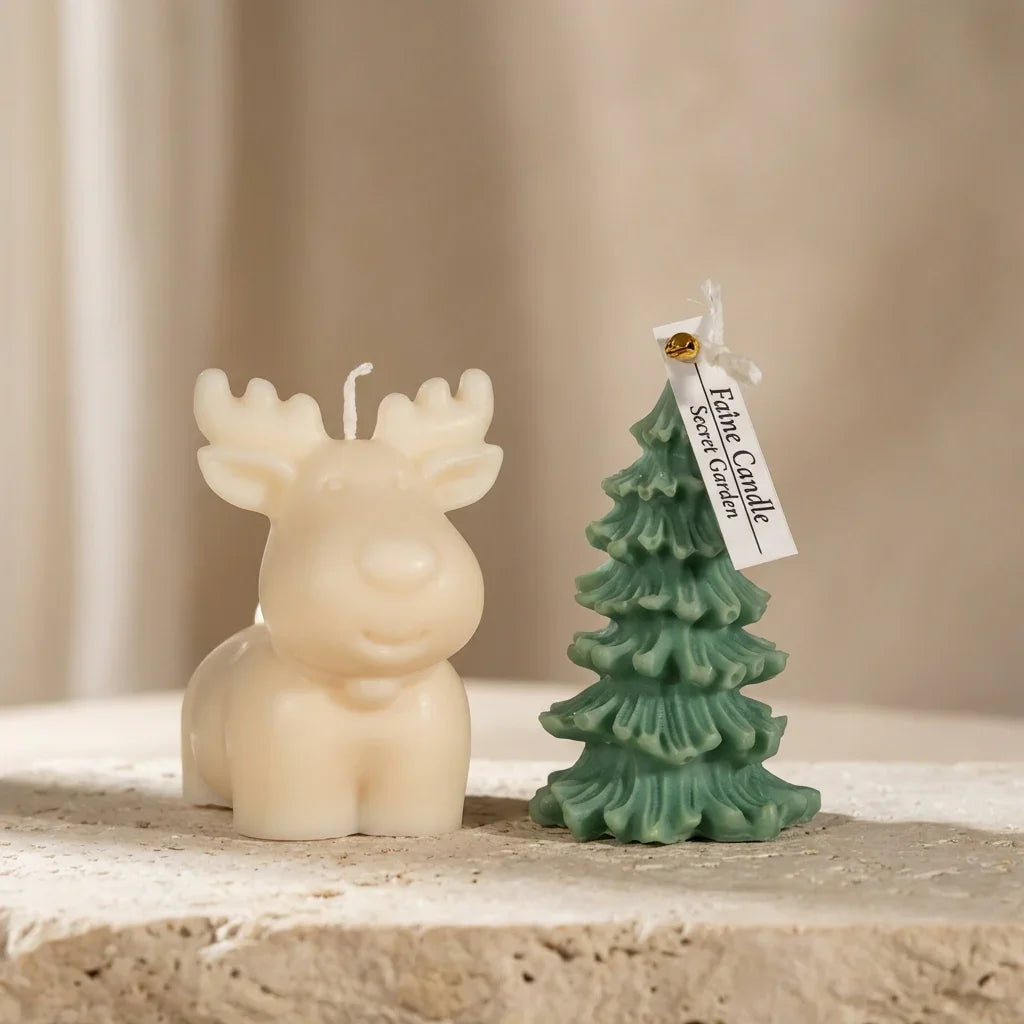 Moose-shaped candle and tree-shaped candle with a tag on a neutral background