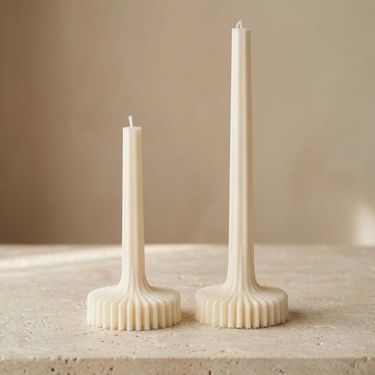 Grand architectural ribbed column candle styled beautifully as a magnificent, minimalist statement piece on an elegant dining table.