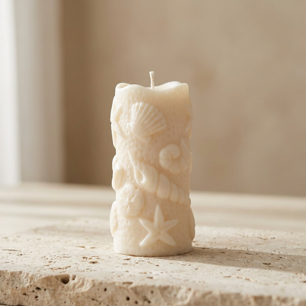 Ocean shell pillar candle styled beautifully as an elegant, serene coastal accent in a relaxing bathroom setup.