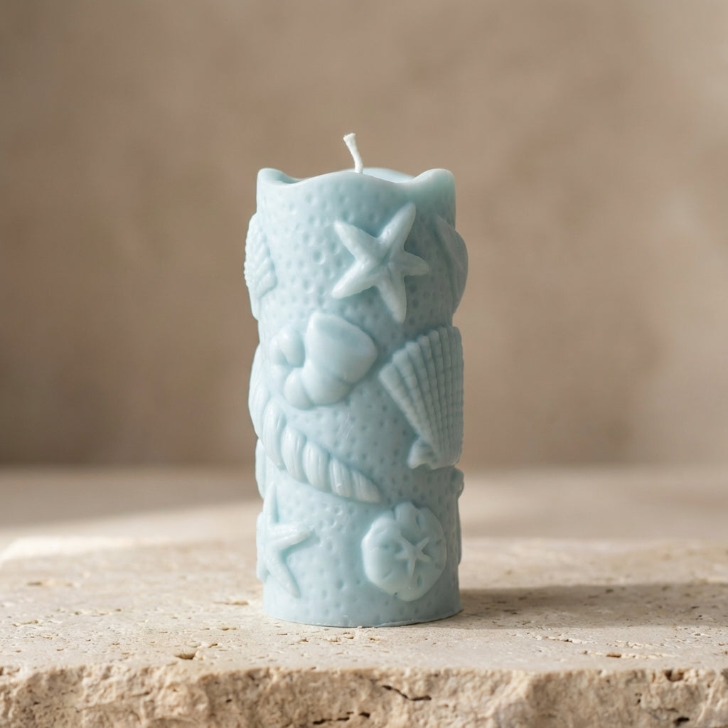 Ocean shell pillar candle styled beautifully as an elegant, serene coastal accent in a relaxing bathroom setup.