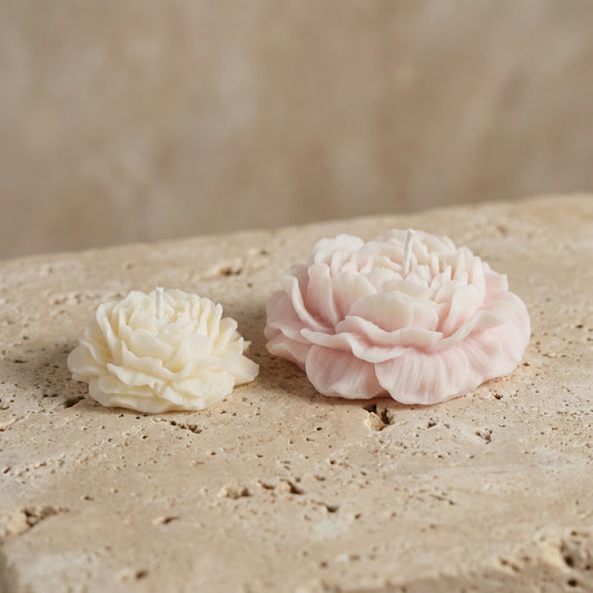 Close-up of a beautifully curated hand-poured soy wax romantic blooming floral duo highlighting a blush pink peony and an ivory-white miniature ruffled blossom.