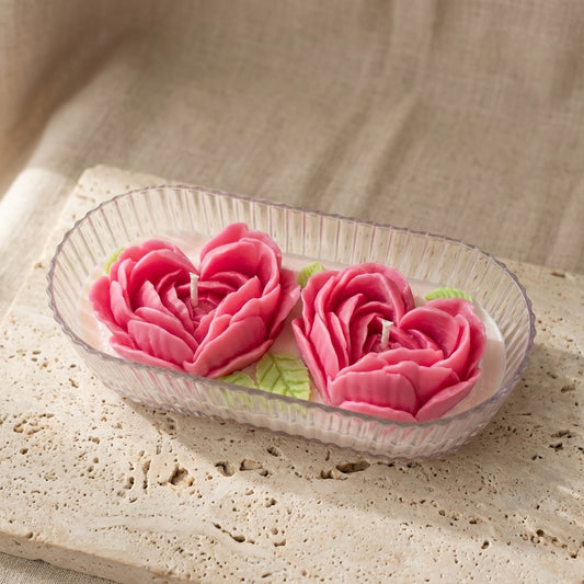 Beautiful two-wick rose heart centerpiece burning brightly, styled effortlessly as an elegant, romantic gift on a stylish bedroom vanity or dinner table.