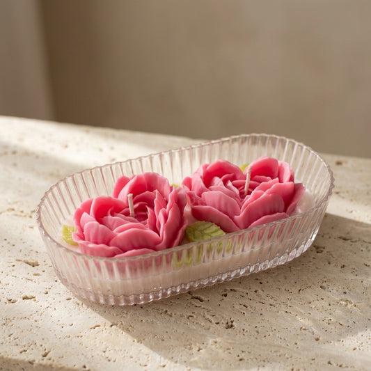 Beautiful two-wick rose heart centerpiece burning brightly, styled effortlessly as an elegant, romantic gift on a stylish bedroom vanity or dinner table.