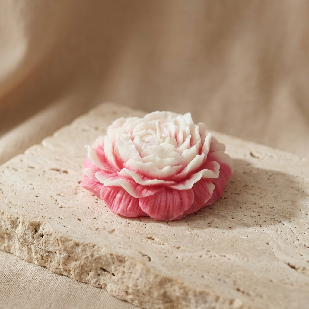 Sculptural peony blossom candle styled elegantly as a sophisticated, romantic botanical accent on a modern bedroom vanity.