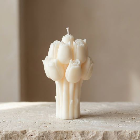 Close-up of a hand-poured soy wax sculptural tulip bouquet candle highlighting its beautifully bundled cluster of closed buds and textured stems.
