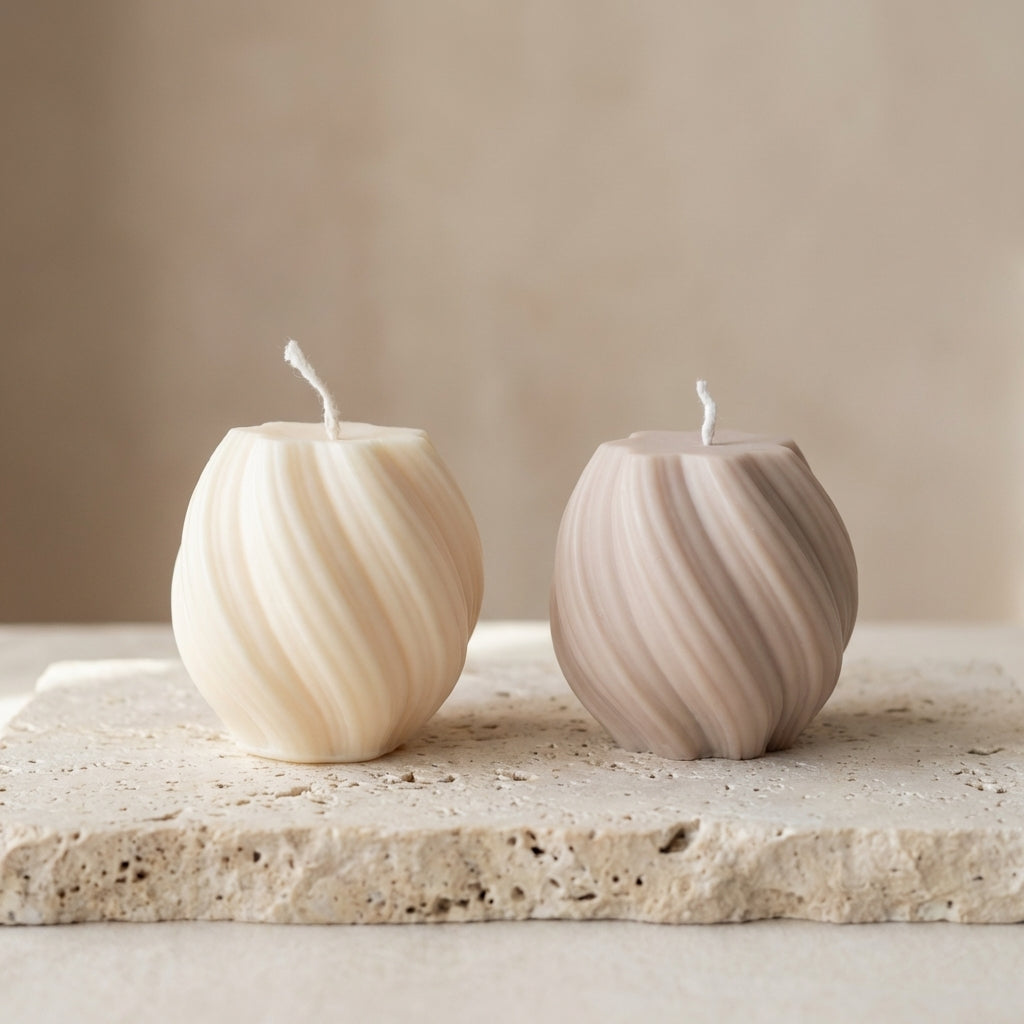 Swirl globe candle styled beautifully as a dynamic, modern geometric accent on a contemporary bookshelf.