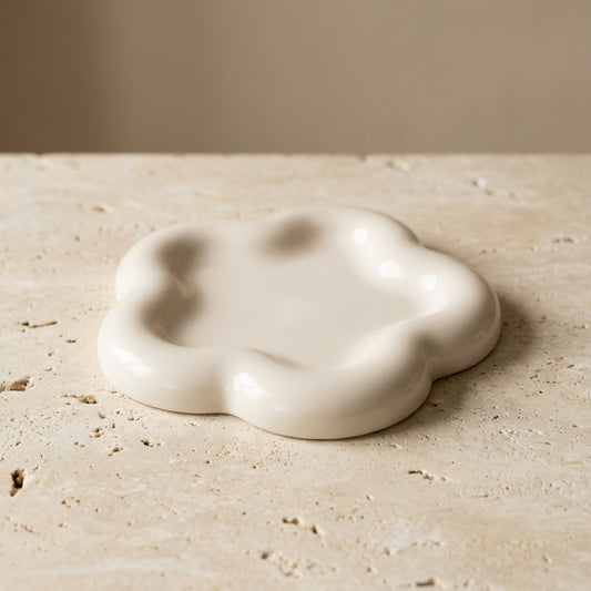 Close-up of a handcrafted wavy cloud tray highlighting its trendy scalloped silhouette and beautifully smooth finish.