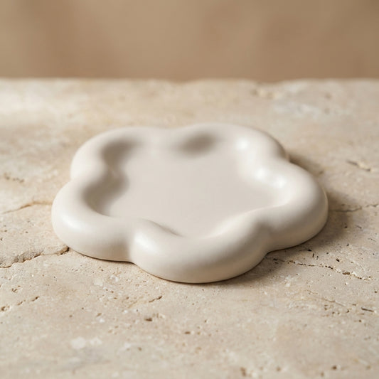 Wavy cloud tray styled beautifully as an aesthetic catch-all dish holding daily jewelry and perfume on a modern nightstand.