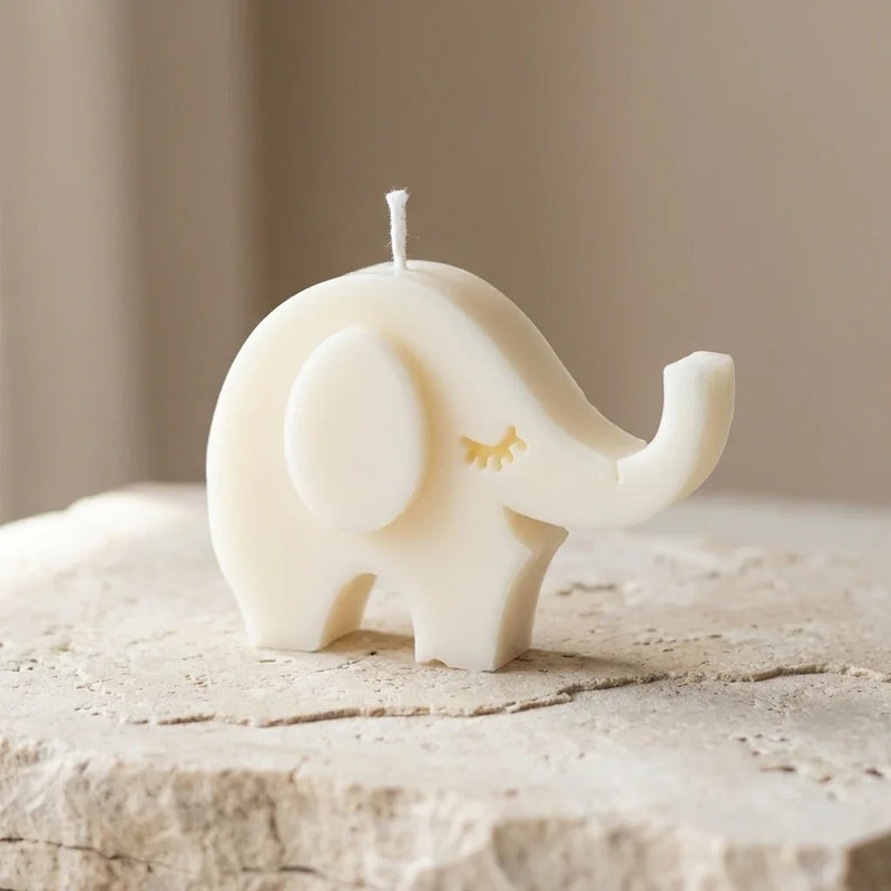 Close-up of a hand-poured soy wax sleepy elephant candle