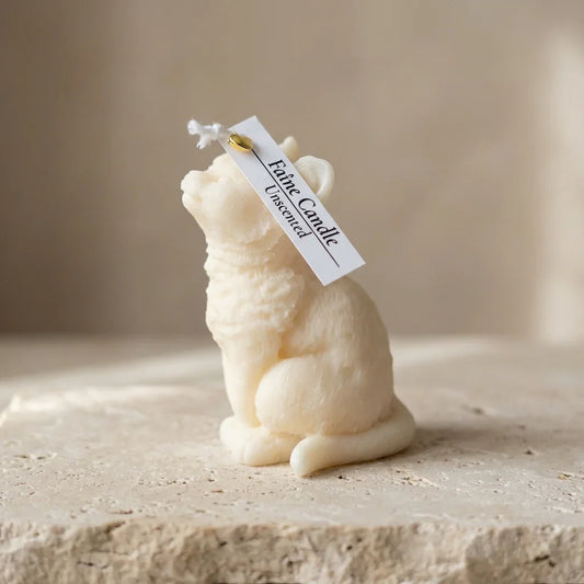 Close-up of a highly textured, hand-poured soy wax fluffy cat candle showing a peaceful, contented expression.